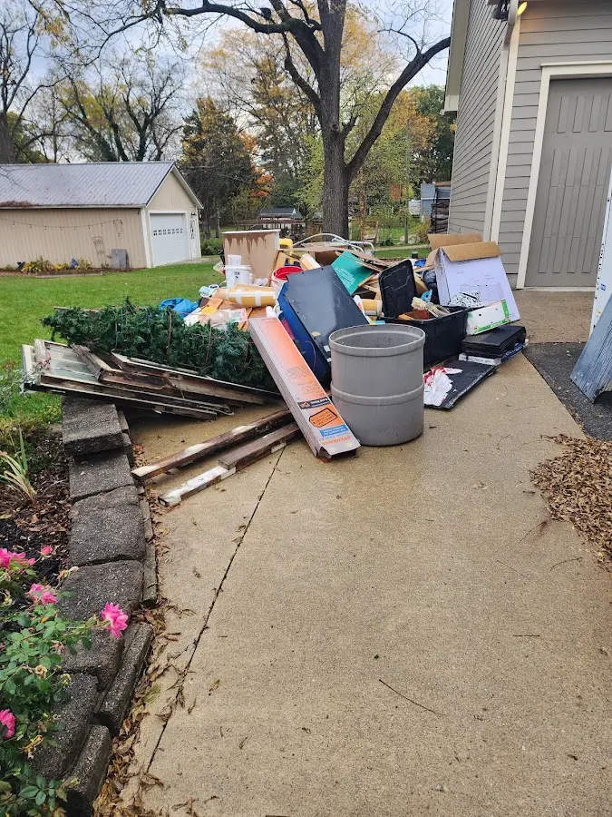 Dumpster being loaded with debris for Demolition Dumpster Rental in Earlimart